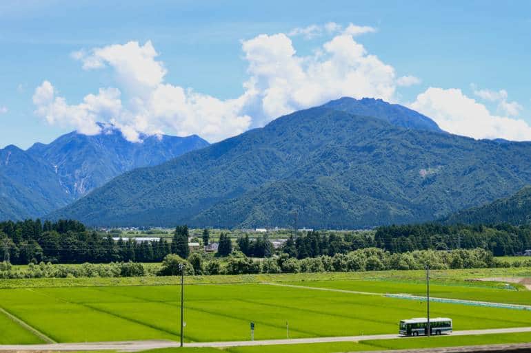 bus passing through rice fields in Japan