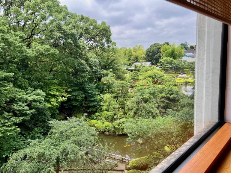 View over Japanese garden from private dining room at Nadaman Kioi