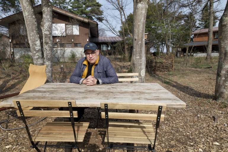 Luis Mendo sitting outside